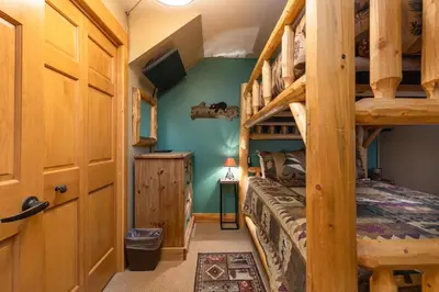 a bedroom with bunk beds in a cabin at 8766 Trappers Crossing townhouse in Keystone