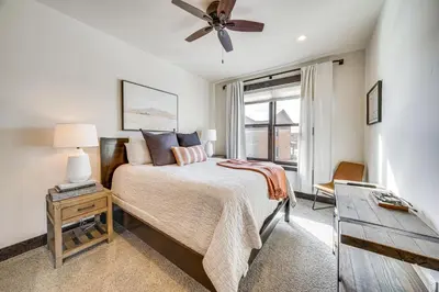 a bedroom with a bed and a ceiling fan at 8 Mi to Keystone Resort Mtn-View Townhome in Silverthorne