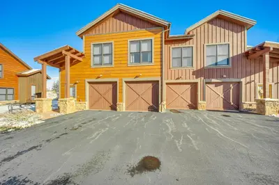 a house with a driveway in front of it at 8 Mi to Keystone Resort Mtn-View Townhome in Silverthorne