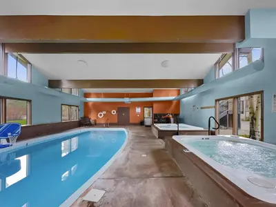 a large swimming pool with a large tub in a house at A106 Lake Cliffe condo in Dillon