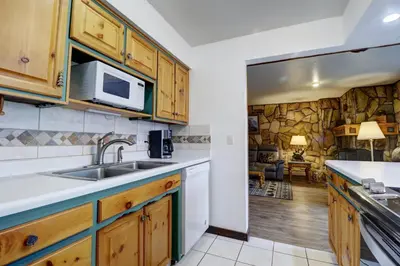 a kitchen with a sink and a microwave at A106 Lake Cliffe condo in Dillon