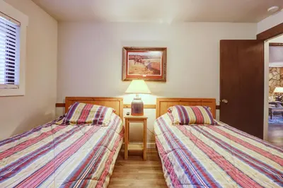 two beds sitting next to each other in a room at A106 Lake Cliffe condo in Dillon