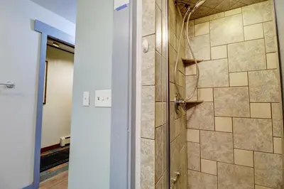a bathroom with a shower with a glass door at A106 Lake Cliffe condo in Dillon