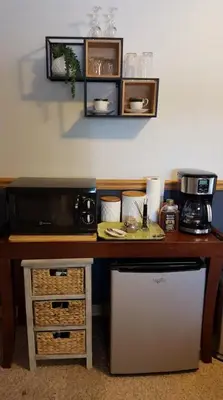a kitchen with a counter top with a microwave at Cozy Garden Level Apartment Studio by Lake Loveland in Loveland