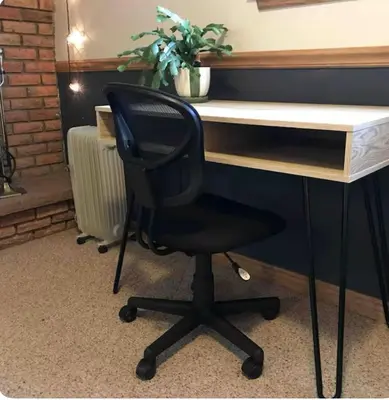 a black chair sitting in front of a desk at Cozy Garden Level Apartment Studio by Lake Loveland in Loveland