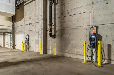 a parking garage with a parking meter next to a wall at Buffalo Lodge 8386 in Keystone