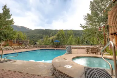 a swimming pool with a view of a mountain at Buffalo Lodge 8386 in Keystone