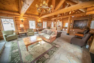a living room with a couch and chairs in a cabin at Settlers Creek 6536 by SummitCove Lodging in Keystone