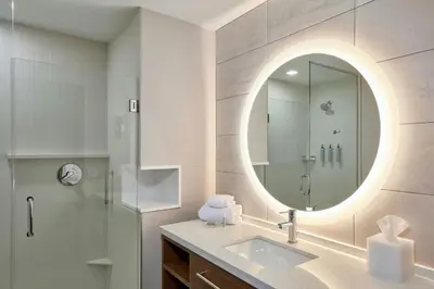 a bathroom with a sink and a mirror at Courtyard by Marriott Denver Downtown West in Denver