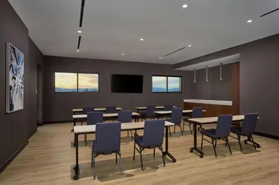 a conference room with a long table and chairs at Courtyard by Marriott Denver Downtown West in Denver