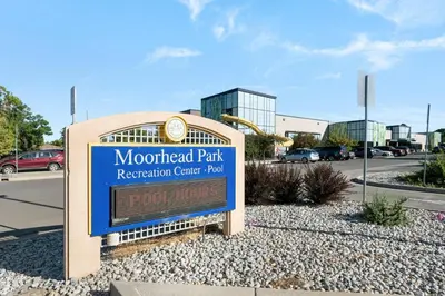 a sign for the montford park recreation center park at Iola in Aurora