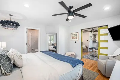 a bedroom with a bed and a ceiling fan at Backyard Wonderland Ultimate Outdoor Fun in Denver