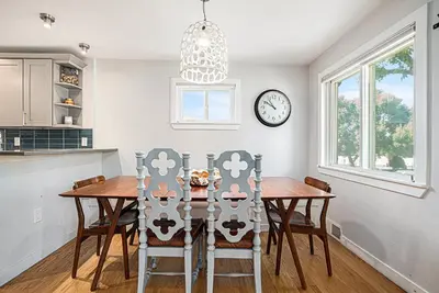 a kitchen and dining room with a table and chairs at Backyard Wonderland Ultimate Outdoor Fun in Denver