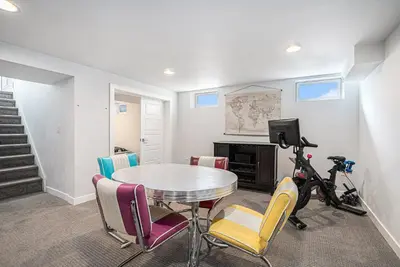 a dining room with a table and chairs at Backyard Wonderland Ultimate Outdoor Fun in Denver