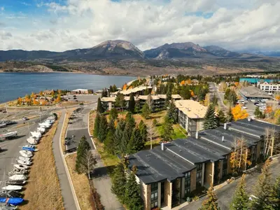 an aerial view of a city with a lake and mountains at A105 Lake Cliffe condo in Dillon