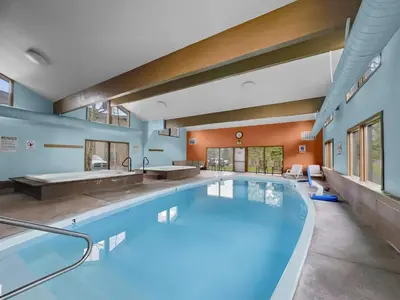 a large swimming pool in a large room with a large at A105 Lake Cliffe condo in Dillon