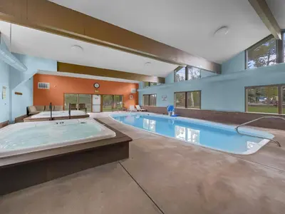 a large swimming pool with a large tub in a house at A105 Lake Cliffe condo in Dillon