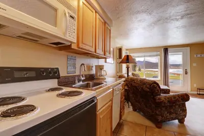 a kitchen with a sink and a stove top oven at Yacht Club 27 condo in Dillon