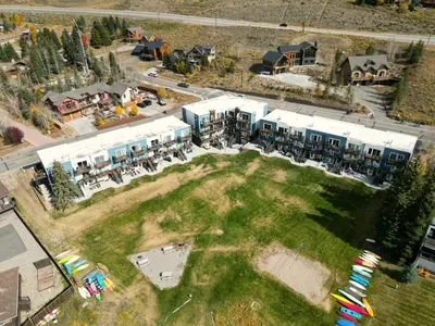 an aerial view of a building with a large yard at Yacht Club 27 condo in Dillon