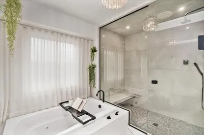 a white bathroom with a tub and a shower at Townhouse near Cherry Creek w gym in Denver
