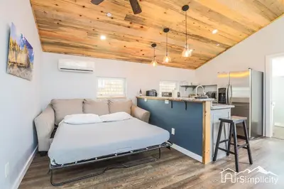 a bedroom with a bed and a kitchen at Heart of Golden Balcony Near Mtns & Red Rocks in Golden