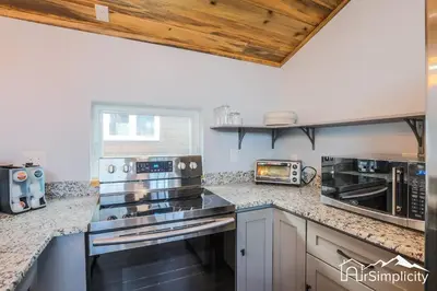 a kitchen with stainless steel appliances and a counter top at Heart of Golden Balcony Near Mtns & Red Rocks in Golden