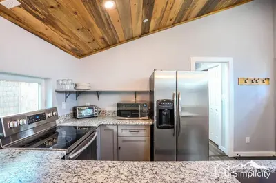 a kitchen with a stainless steel refrigerator at Heart of Golden Balcony Near Mtns & Red Rocks in Golden