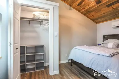 a bedroom with a bed and a closet at Heart of Golden Balcony Near Mtns & Red Rocks in Golden