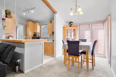 a kitchen and dining room with a table and chairs at A Denver Oasis 15 Min to the Bronco Stadium 3 Bedroom with a King Suite in Denver