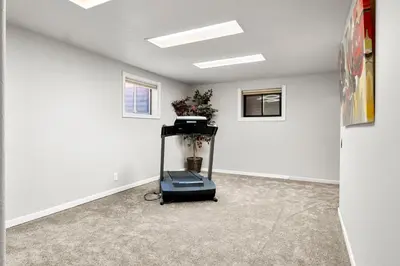 an empty room with a vacuum in the corner at A Denver Oasis 15 Min to the Bronco Stadium 3 Bedroom with a King Suite in Denver