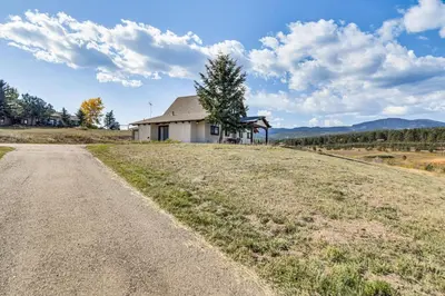 an empty road in front of a house at 5 Mi to Dtwn Evergreen Mtn-View Escape in Evergreen