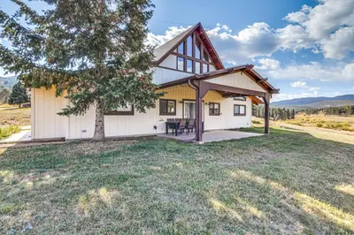an exterior view of a house with a tree at 5 Mi to Dtwn Evergreen Mtn-View Escape in Evergreen