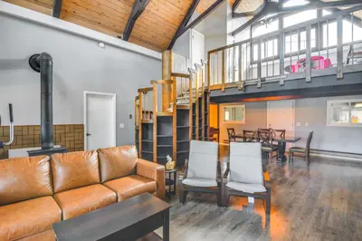 a living room with a couch and a table at 5 Mi to Dtwn Evergreen Mtn-View Escape in Evergreen