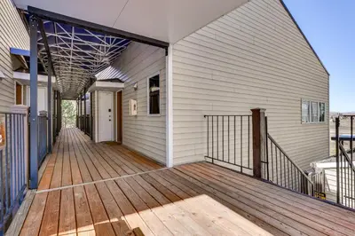an open porch of a house with a wooden deck at Walk to Ski Lift and Hiking Granby Ranch Condo! in Granby