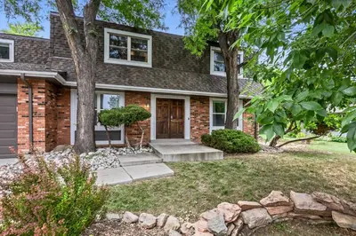 a brick house with a door and trees at Modern Family Haven Fenced Yrd GrillFirepit in Westminster