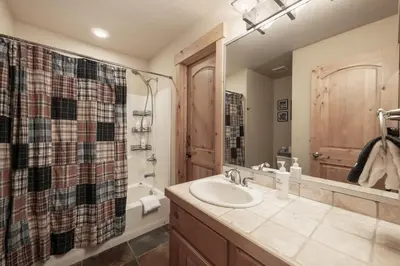 a bathroom with a sink and a shower at Antler at Lakota 407 home in Winter Park