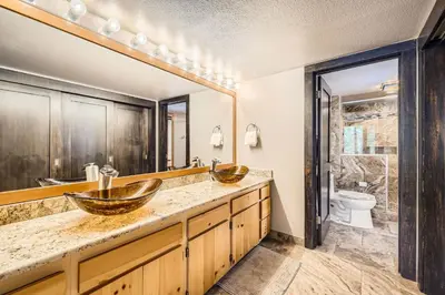 a bathroom with two sinks and a toilet at 1776 Decatur condo in Dillon