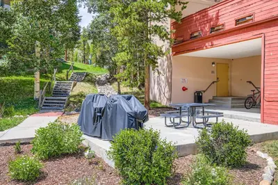 a patio with a table outside of a building at 1776 Decatur condo in Dillon