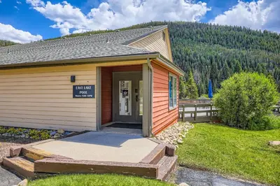 a small building with a sign on the door at 1776 Decatur condo in Dillon