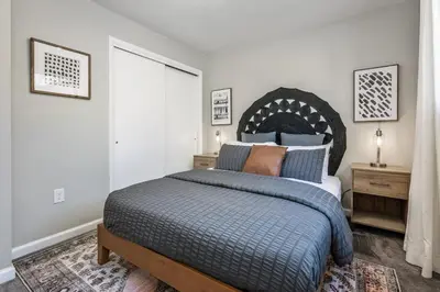 a bedroom with a bed and a large window at Colorado home near Red Rocks w fenced yard in Wheat Ridge