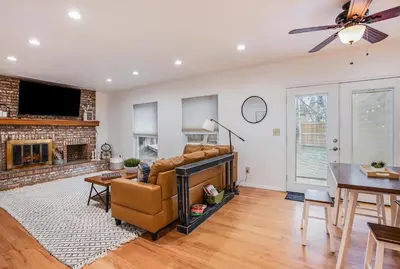 a living room with a couch and a fireplace at Suburban Sanctuary Sauna Tub Large Yard in Westminster