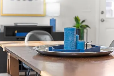 a tray with blue candles on a table at The Denver Den Game Room Foosball in Westminster