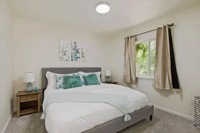 a bedroom with a bed and a window at Fire Pit Funhouse 2 Master Suites Game Rm in Westminster