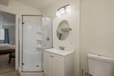 a white bathroom with a shower and a sink at Fire Pit Funhouse 2 Master Suites Game Rm in Westminster