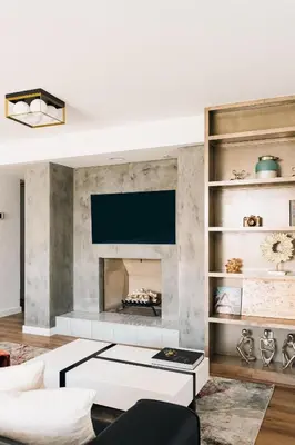 a living room with a fireplace and a tv at Deluxe Larimer Square Retreat - Walk Everywhere! in Denver