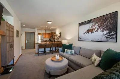 a living room with a couch and a table at Premium Unit 2308 - 1Br - Zephyr Mountain Lodge condo in Winter Park