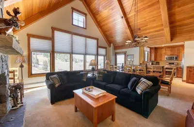 a large living room with a couch and a table at Premium Unit 2801 - Zephyr Mountain Lodge condo in Winter Park
