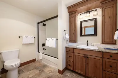 a bathroom with a toilet and a sink at Premium Unit 2801 - Zephyr Mountain Lodge condo in Winter Park