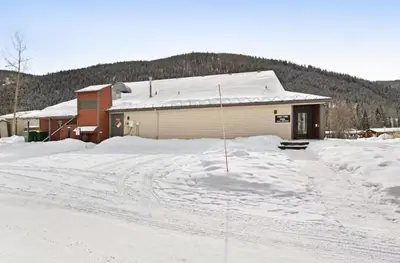 a house with a lot of snow in front of it at 1765 Montezuma condo in Keystone