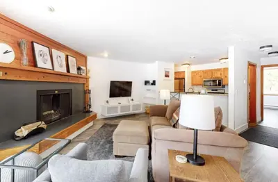 a living room with a couch and a fireplace at 1765 Montezuma condo in Keystone